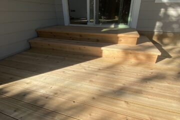 New deck with unfinished light-colored wood